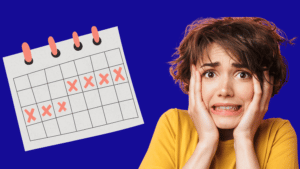 Woman with stressed expression looking at a calendar