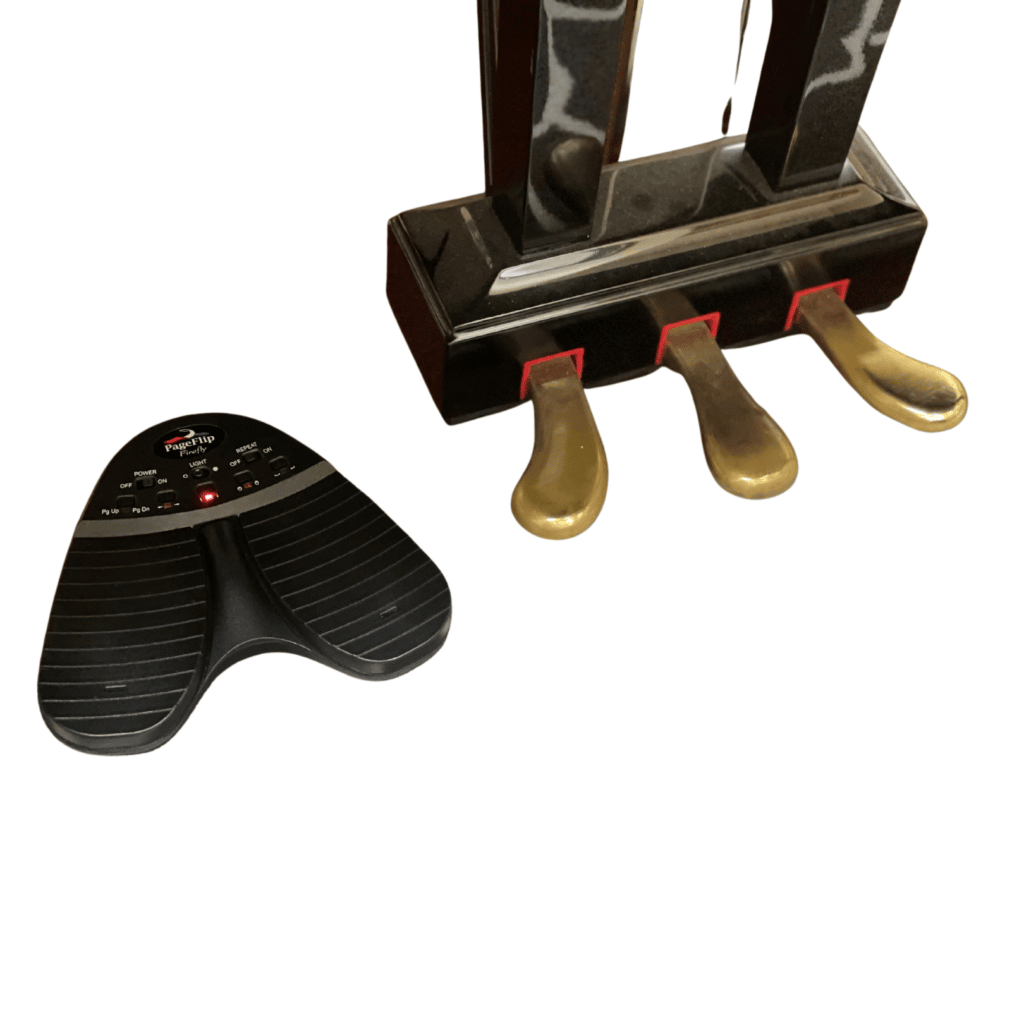 Firefly Pedal next to piano pedals