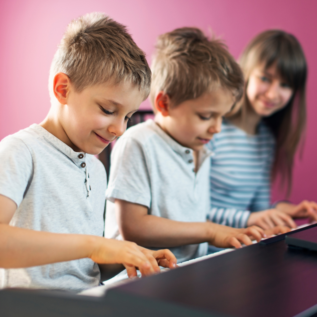 Kids playing around on a piano