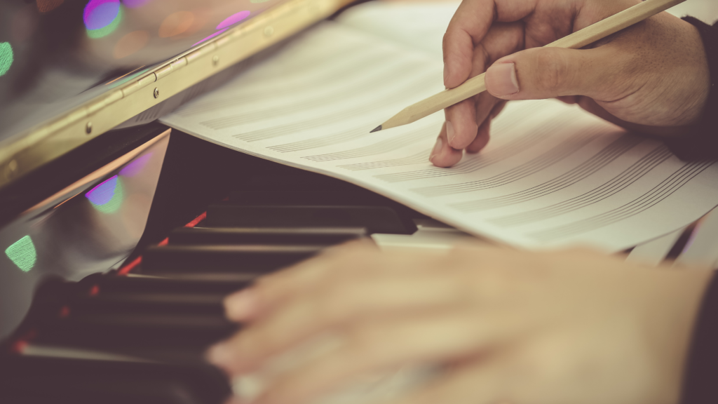 Student composing music at the piano